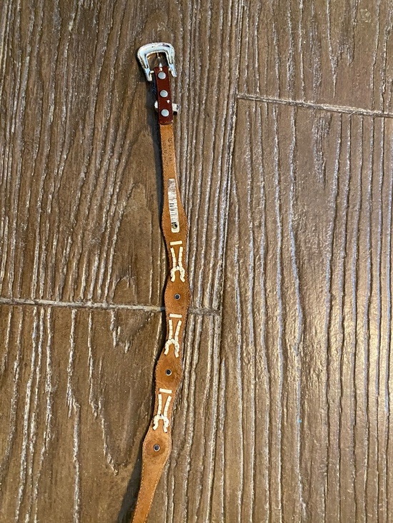 Brown Western leather concho belt. Bought in Jackson Hole, Wyoming years ago